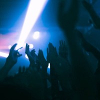 silhouette raised hands of women and men dancing at nightclub - concert stock pictures, royalty-free photos & images