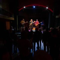 silhouetted audience watching band performing onstage - concert stock pictures, royalty-free photos & images