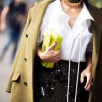 Silvia Braz wears white shirt, dark sequence skirt, green coat and bright green Gucci bag outside Gucci show during the Milan Fashion Week...