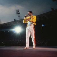 Singer Freddie Mercury performing with Queen at Wembley Stadium, London, July 1986. The band played two nights at the venue, as part of the Magic...