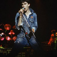 Singer Jimmy Pursey of British punk band Sham 69 performs on stage circa 1977.