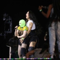 Singer Madonna wears a mask during a rehearsal with Brazilian singer Pabllo Vittar on stage at Copacabana Beach on May 3, 2024 in Rio de Janeiro,...