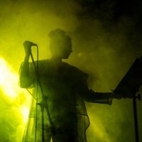 singer performing on, stage light and smoke effects. - concert stock pictures, royalty-free photos & images