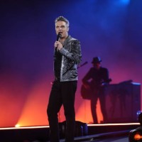 Singer Robbie Williams performs live on stage during his One Show & One Night Only concert at Messe Muenchen on August 27, 2022 in Riem/Munich,...