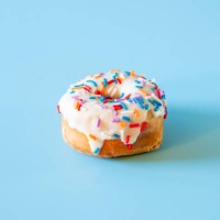 single donut on blue background - junk food stock pictures, royalty-free photos & images