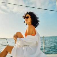 single young female experiences serene travel at sea - travel photos et images de collection
