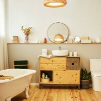 sink with toiletries kept on cabinet by bathtub - home decoration stock pictures, royalty-free photos & images