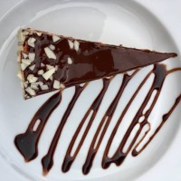 slice of chocolate cake on a plate - junk food stock-fotos und bilder
