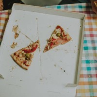 slice of tasty pizza with ham and tomatoes in box - junk food stock pictures, royalty-free photos & images