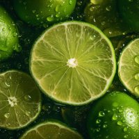 sliced limes showered with water - food stock pictures, royalty-free photos & images