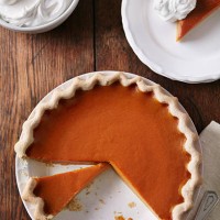 sliced pumpkin pie on wood table, from above - food stock pictures, royalty-free photos & images