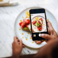 smartphone food photography in action - food stock pictures, royalty-free photos & images