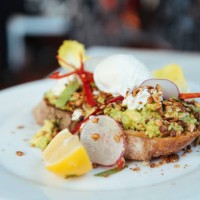 smashed avocado and poached eggs on sourdough bread - food stock pictures, royalty-free photos & images