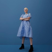 smiling albino woman standing with arms crossed - fashion stock pictures, royalty-free photos & images