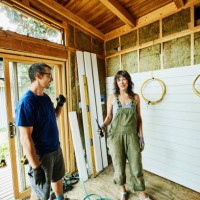 smiling couple working on improvement project - home decoration stock pictures, royalty-free photos & images