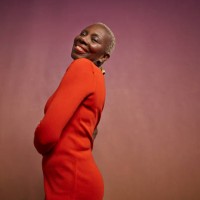 smiling elderly woman in red dress - fashion stock pictures, royalty-free photos & images