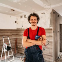smiling electrician renovating house - home decoration stock pictures, royalty-free photos & images