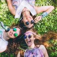 smiling faces of hippie female friends - fashion stock pictures, royalty-free photos & images