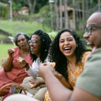 smiling friends at the picnic - food stock pictures, royalty-free photos & images