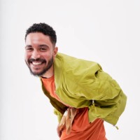 smiling man bending against white background - fashion stock pictures, royalty-free photos & images