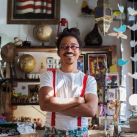 smiling mixed race man wearing suspenders - fashion stock pictures, royalty-free photos & images