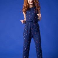 smiling redhead woman in combo suit - fashion stock-fotos und bilder