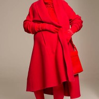 smiling senior woman wearing red coat - fashion stock pictures, royalty-free photos & images