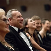 smiling spectators sitting in the theater - concert stock pictures, royalty-free photos & images