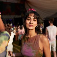 smiling woman dancing by friend at music concert - concert stock pictures, royalty-free photos & images