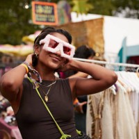 smiling woman wearing novelty glasses with boyfriend - fashion photos et images de collection