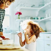 smiling young girl making pizza with mother - food stock pictures, royalty-free photos & images