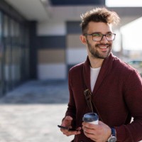 smiling young man commuting to work - junk food stock pictures, royalty-free photos & images