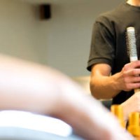 smiling young woman getting new hairstyle in the hair salon - hairstyle stock pictures, royalty-free photos & images