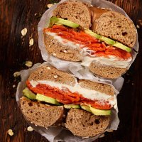 smoked salmon bagel with cream cheese and avocado - junk food stock pictures, royalty-free photos & images