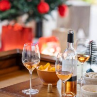 snacks and glasses of wine sitting on a table during a christmas party - home decoration stock pictures, royalty-free photos & images
