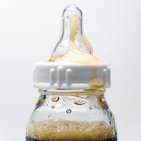 soda in baby bottle - junk food stock-fotos und bilder