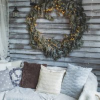 sofa with knit blankets and cushions on home cozy terrace with christmas decoration. - garden decoration stock pictures, royalty-free photos & images