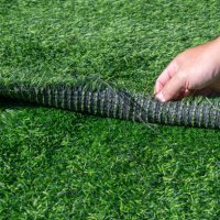 someone hand pulling an artificial turf before replacement. artificial turf is used for covering sport arena or garden. - garden decoration stock pictures, royalty-free photos & images