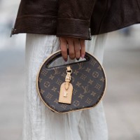 Sonia Lyson wears white pants Zara, brown leather jacket Ducie London, Louis Vuitton round bag on the way to Lueder during the Berlin Fashion Week...
