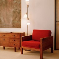 soothing light from a floor lamp illuminates a corner of the bedroom - home decoration stock pictures, royalty-free photos & images