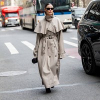 Sophia Roe wears grey belted coat outside Altuzarra during New York Fashion Week on February 08, 2025 in New York City.