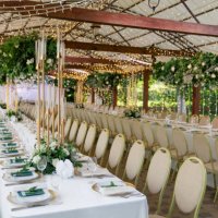 spacious wedding reception decorated with lights and greenery - garden decoration stock pictures, royalty-free photos & images