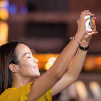 spectator recording concert on her phone - concert stock pictures, royalty-free photos & images