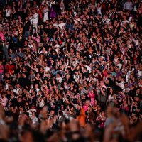 Spectators cheers as US singer and songwriter Taylor Alison Swift, also known as Taylor Swift performs on stage at the Paris La Defense Arena as part...