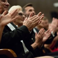 spectators clapping in the theater, focus on hands - concert stock pictures, royalty-free photos & images