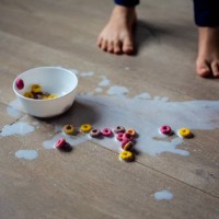 spilled bowl of milk and cereal - food stock pictures, royalty-free photos & images