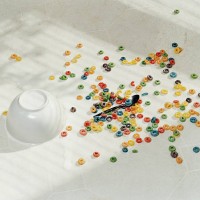 spilt bowl of cereal on white floor - food stock pictures, royalty-free photos & images
