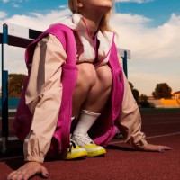 sport girl on racetrack doing warm-up - stock photo - fashion stock pictures, royalty-free photos & images