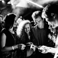 spraklers glowing, smile on their faces, favorite band playing, let's get this party started. black and white photo - concert stock pictures, royalty-free photos & images