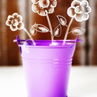 spring concept with purple bucket and flowers - garden decoration stock pictures, royalty-free photos & images